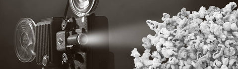 movie projector shining on gourmet popcorn