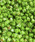 Close-up of specialty air popped green apple flavored popcorn from Popped! Republic