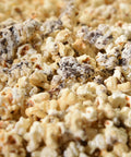Close-up of gourmet kettle corn with white chocolate and crumbled oreos 