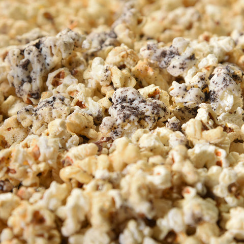 Close-up of gourmet kettle corn with white chocolate and crumbled oreos 