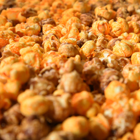 Close-up of gourmet caramel and orange cheese popcorn from Popped! Republic