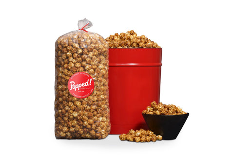Red bucket and an extra large bulk bag of Classic Caramel popcorn from Popped! Republic
