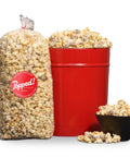Red bucket and an extra large bulk bag of Cookies and Cream kettle corn from Popped! Republic
